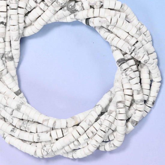 Matte White Howlite heishi disc beads, close view of the coiled strands showing chalky white with grey veining
