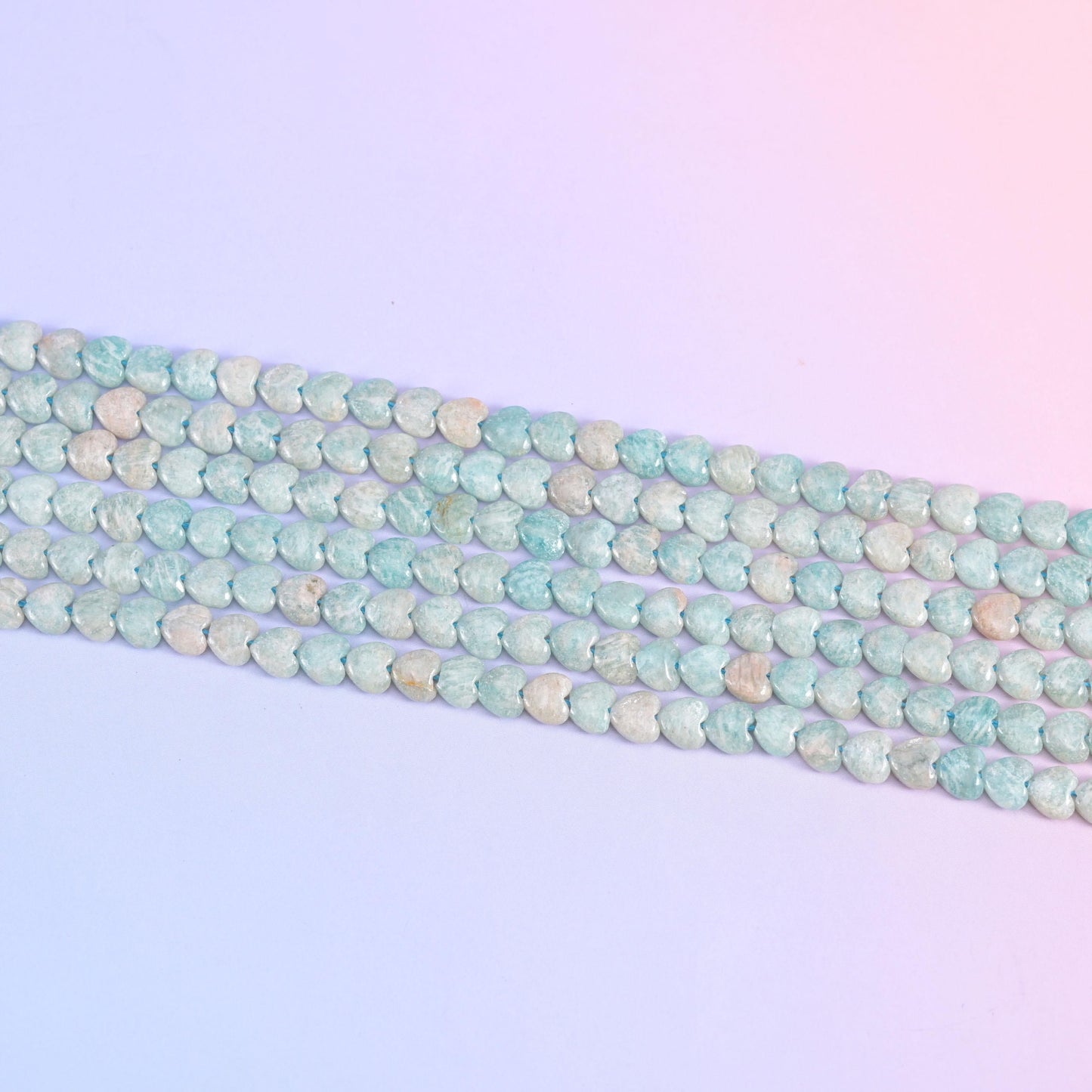 Parallel rows of 6mm Amazonite hearts in soft seafoam blue and cream