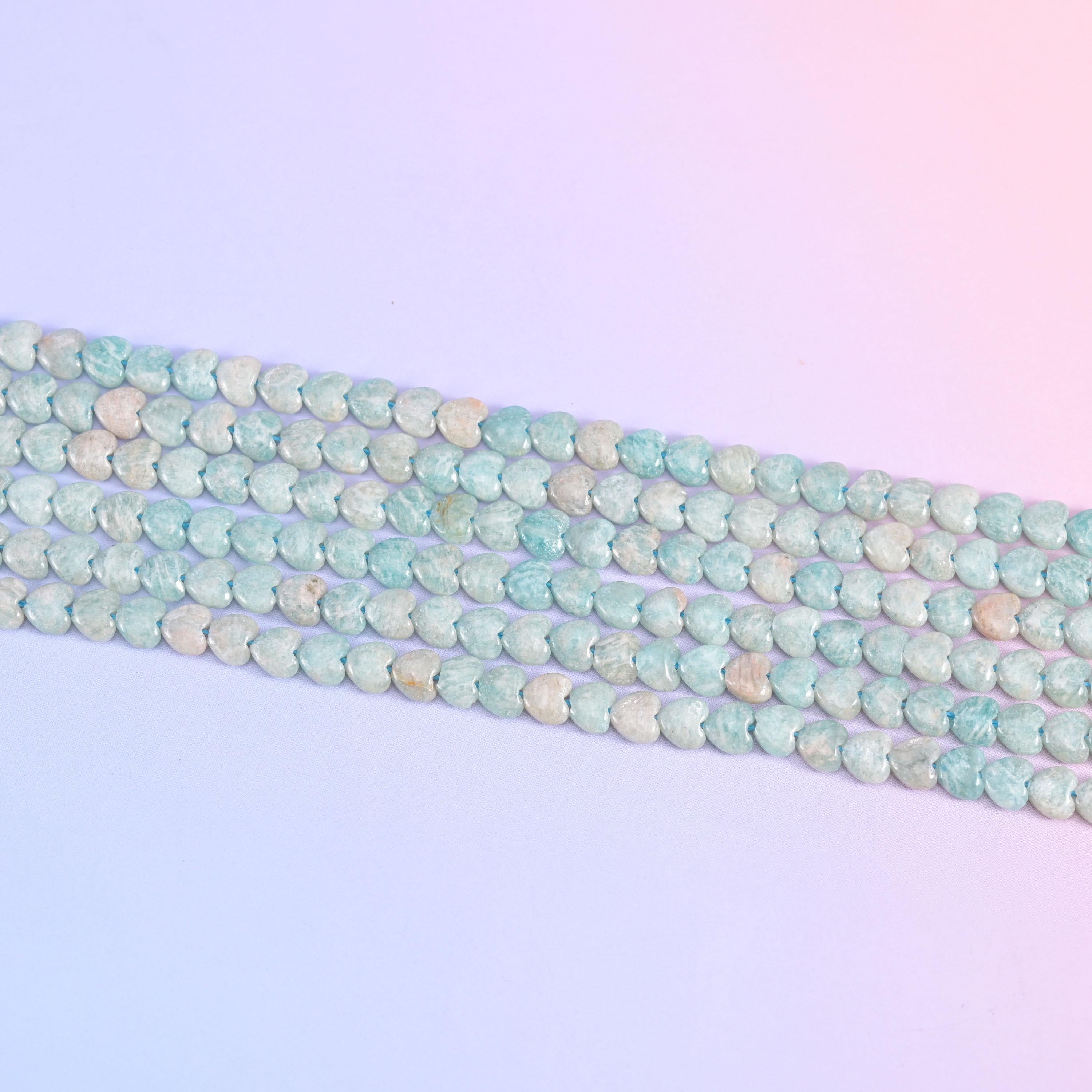 Parallel rows of 6mm Amazonite hearts in soft seafoam blue and cream