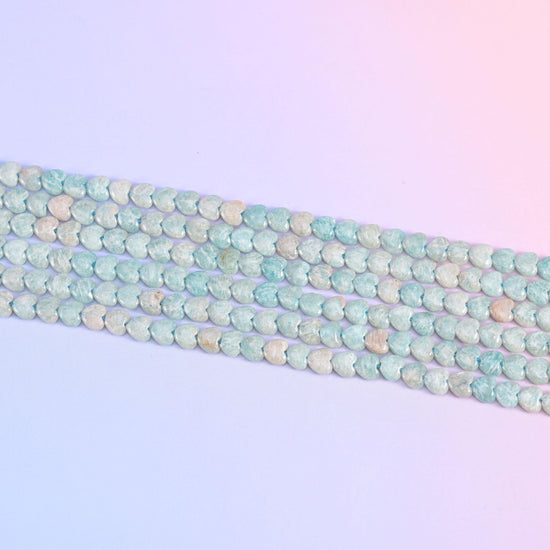 Parallel rows of 6mm Amazonite hearts in soft seafoam blue and cream