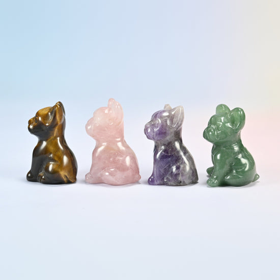 Four small gemstone French bulldogs turned to the side, brown, pink, purple and green
