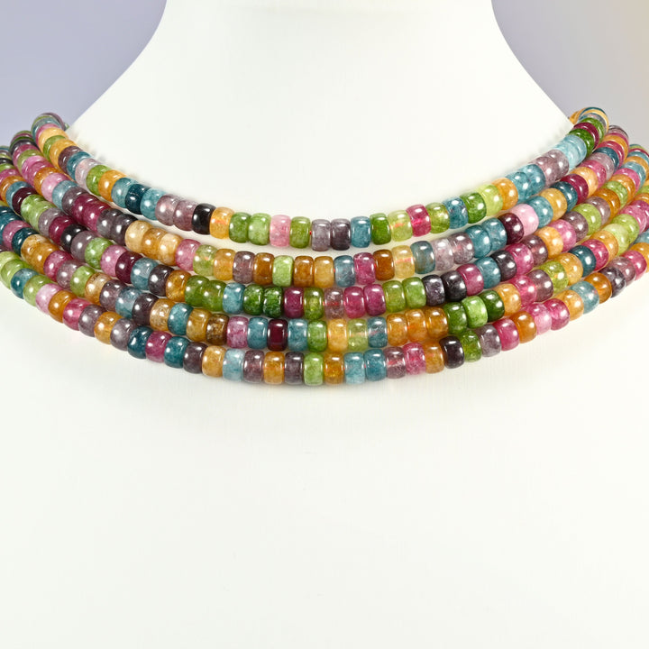Tourmaline Color Dyed Jade round disc beads 3x6mm shown on a white display neck form, four strands of mixed rose pink, teal blue, apple green and golden yellow