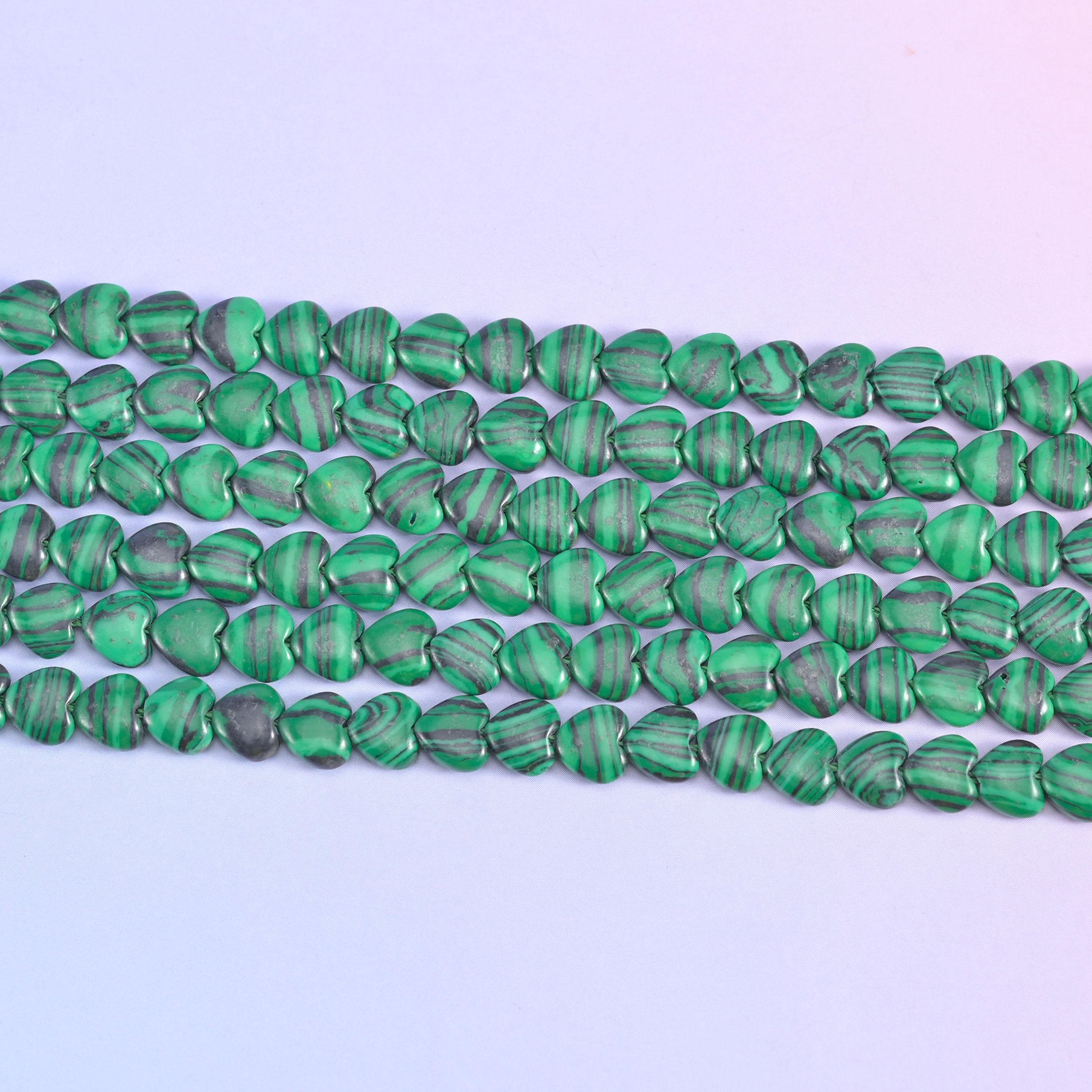 Green Malachite Heart Beads in vivid grass green with pale mint and near-black banding