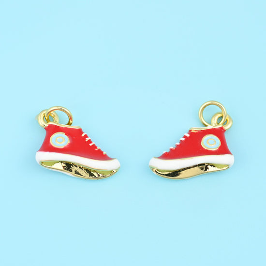 A miniature high-top in glossy enamel, laced in white with a small round patch at the ankle and a polished 18K gold filled…