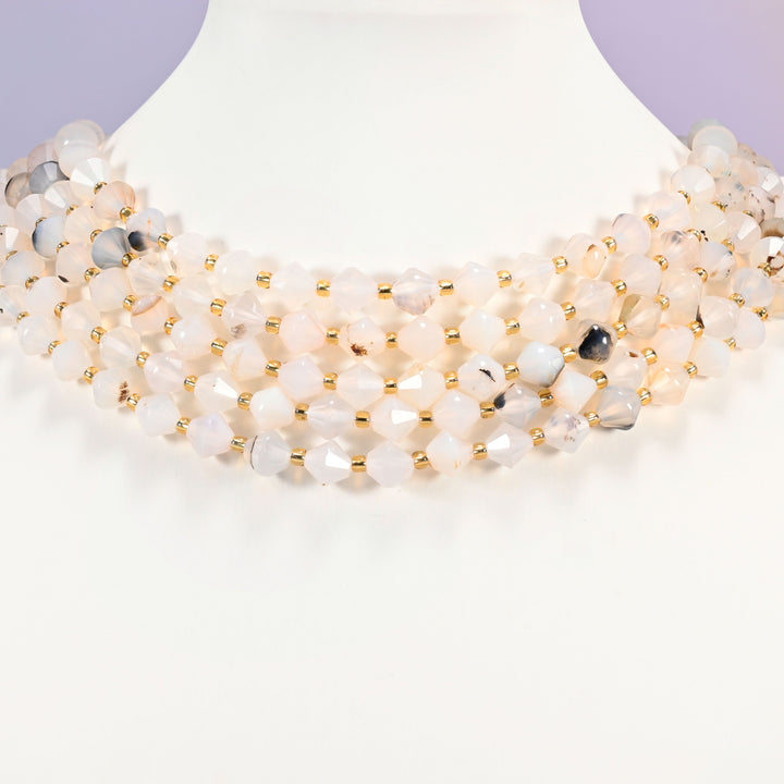 Black Flower Agate bicone bead strand worn as a multi-strand choker on a display neck form.