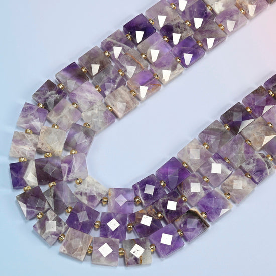 Natural amethyst faceted flat square beads in several strands curved into a wide U, deep purple, lavender and clear stone