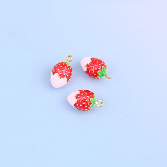 Three strawberry charms dipped in light pink enamel, enamel over 18K gold plated brass.