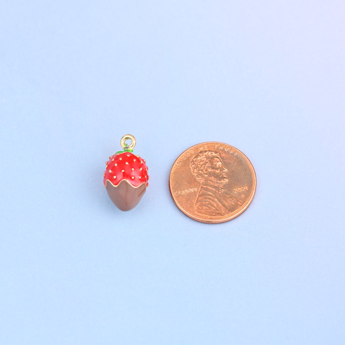 Brown dipped strawberry charm shown at actual size, 17.20 x 9.58mm.