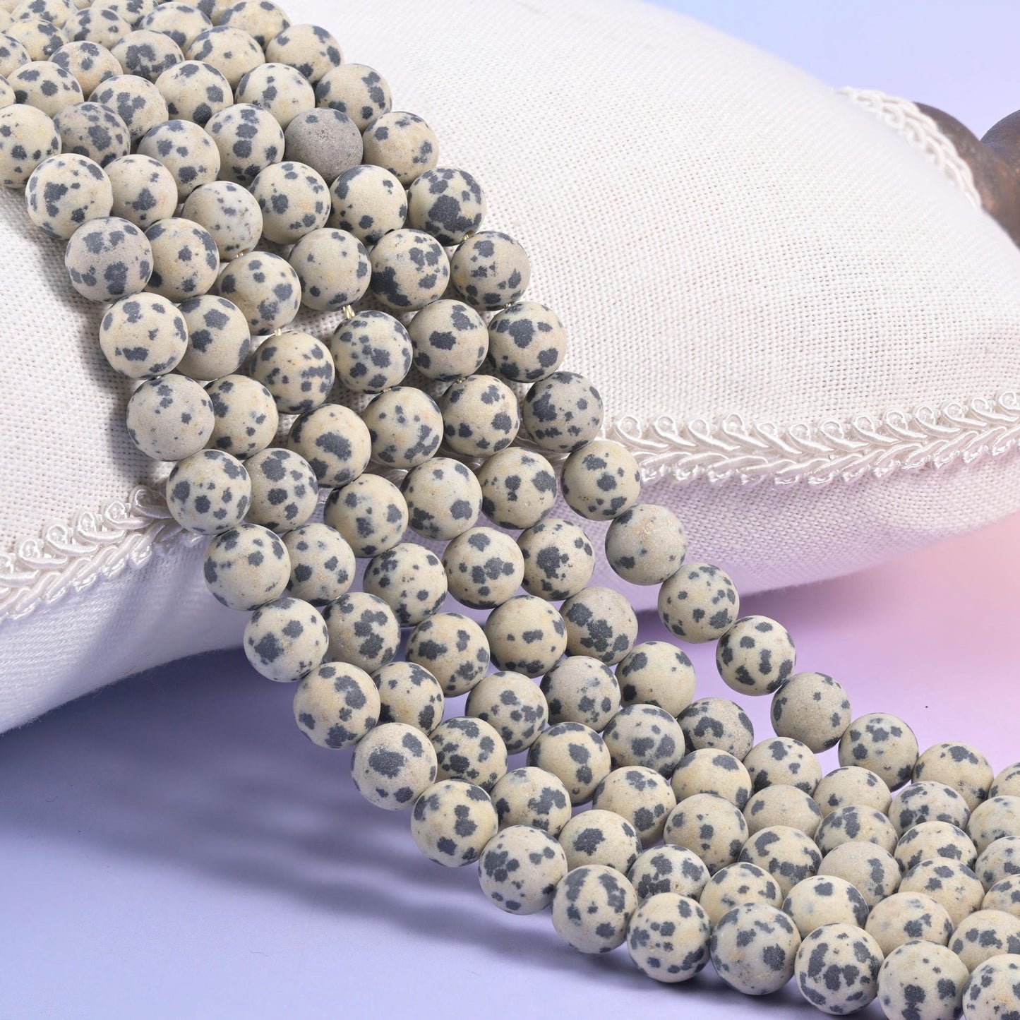 Dalmatian Jasper matte round beads in oatmeal cream scattered with charcoal grey and black spots