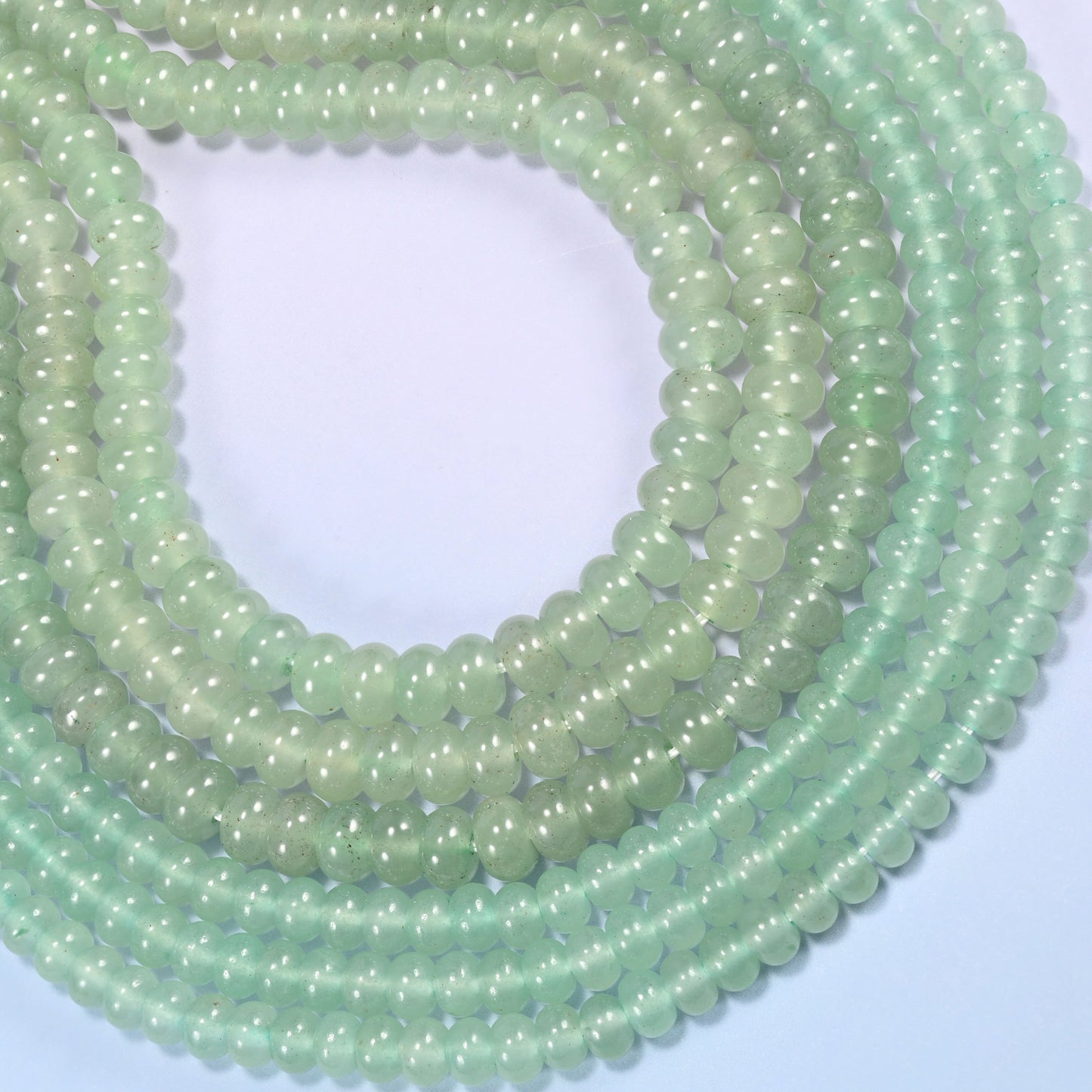 Green Aventurine gemstone rondelle beads coiled into a rounded loop, a 15.5 inch strand holding about 90 or 76 beads