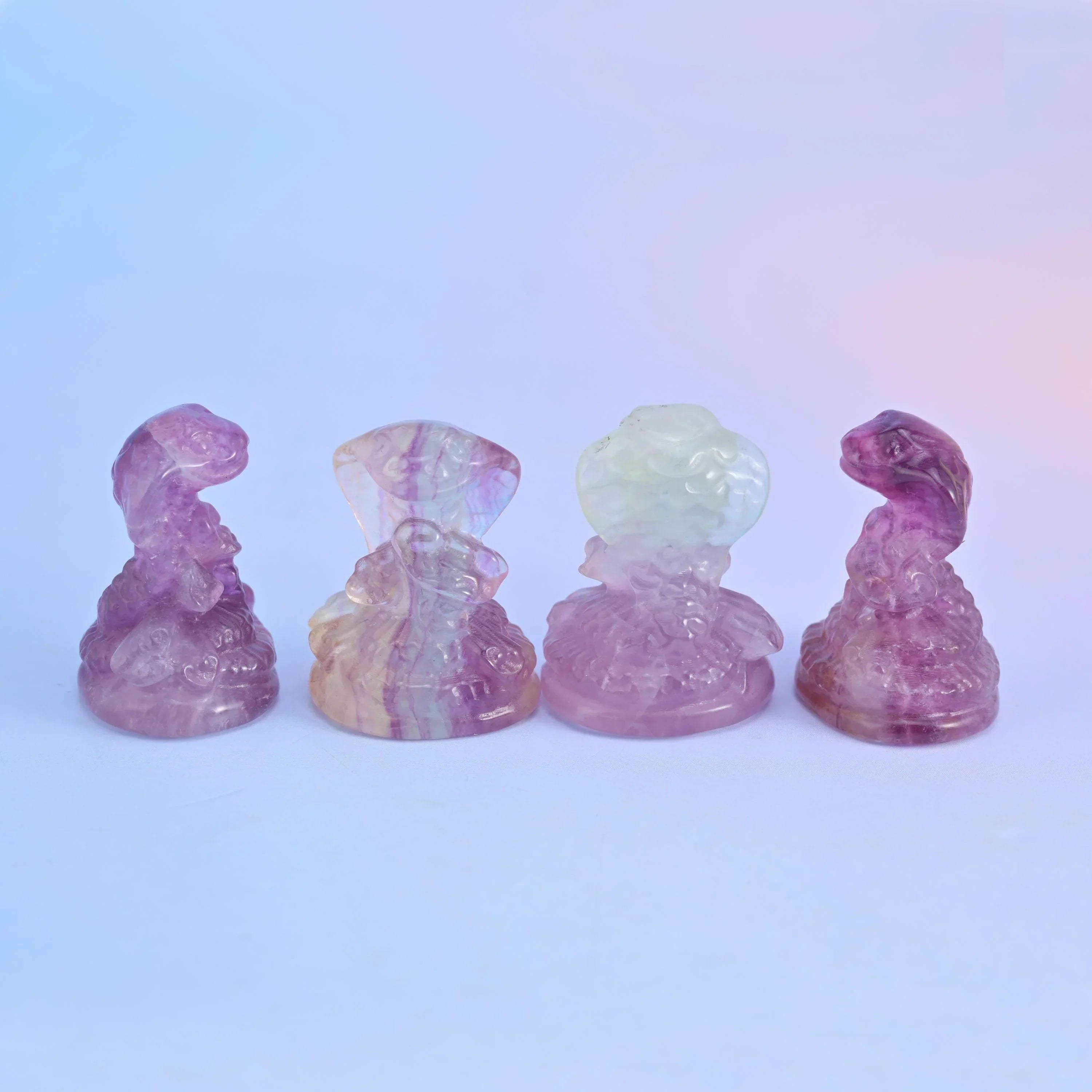 Fluorite cobra snake figurine on a small domed base.