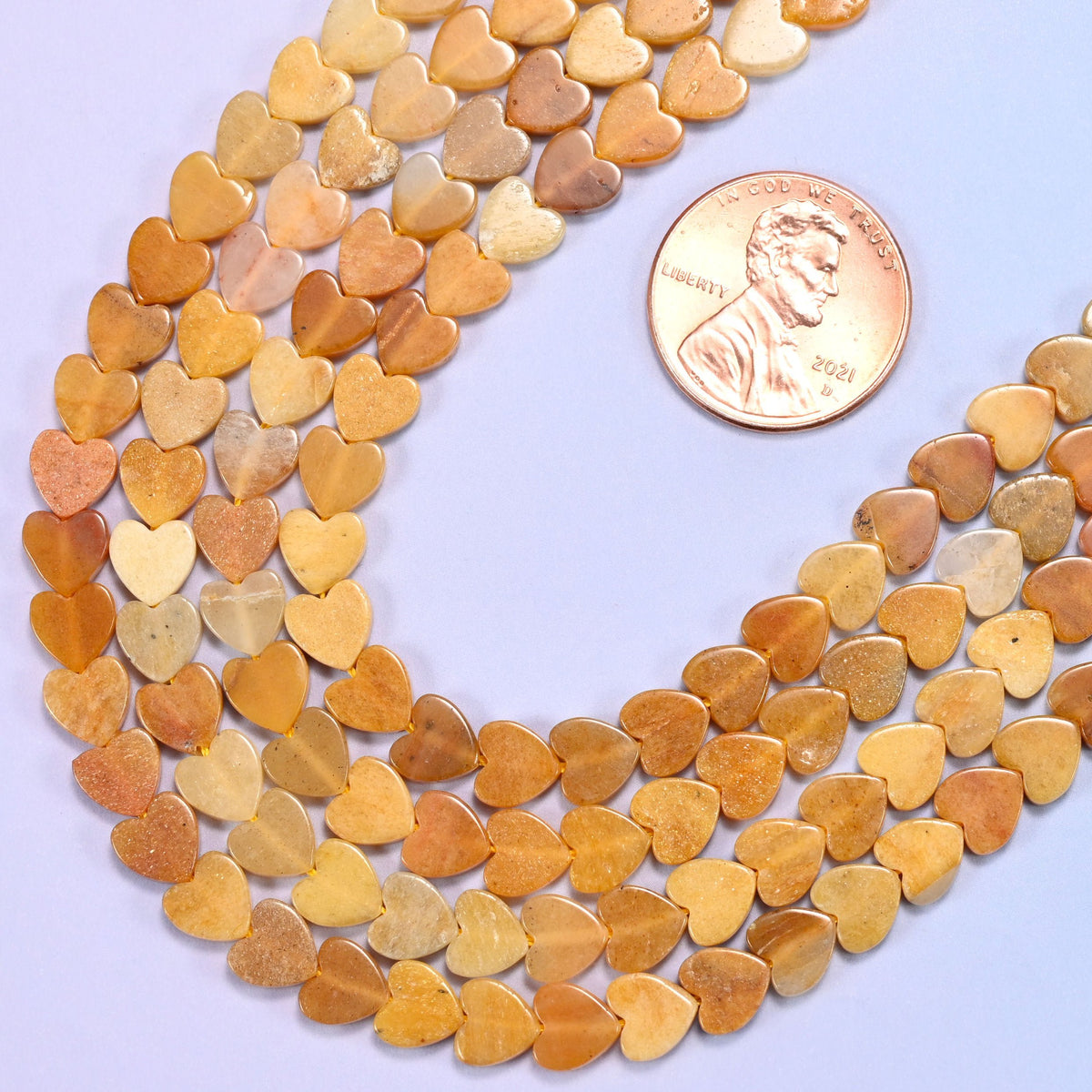 Flat heart cut gold silk jade beads