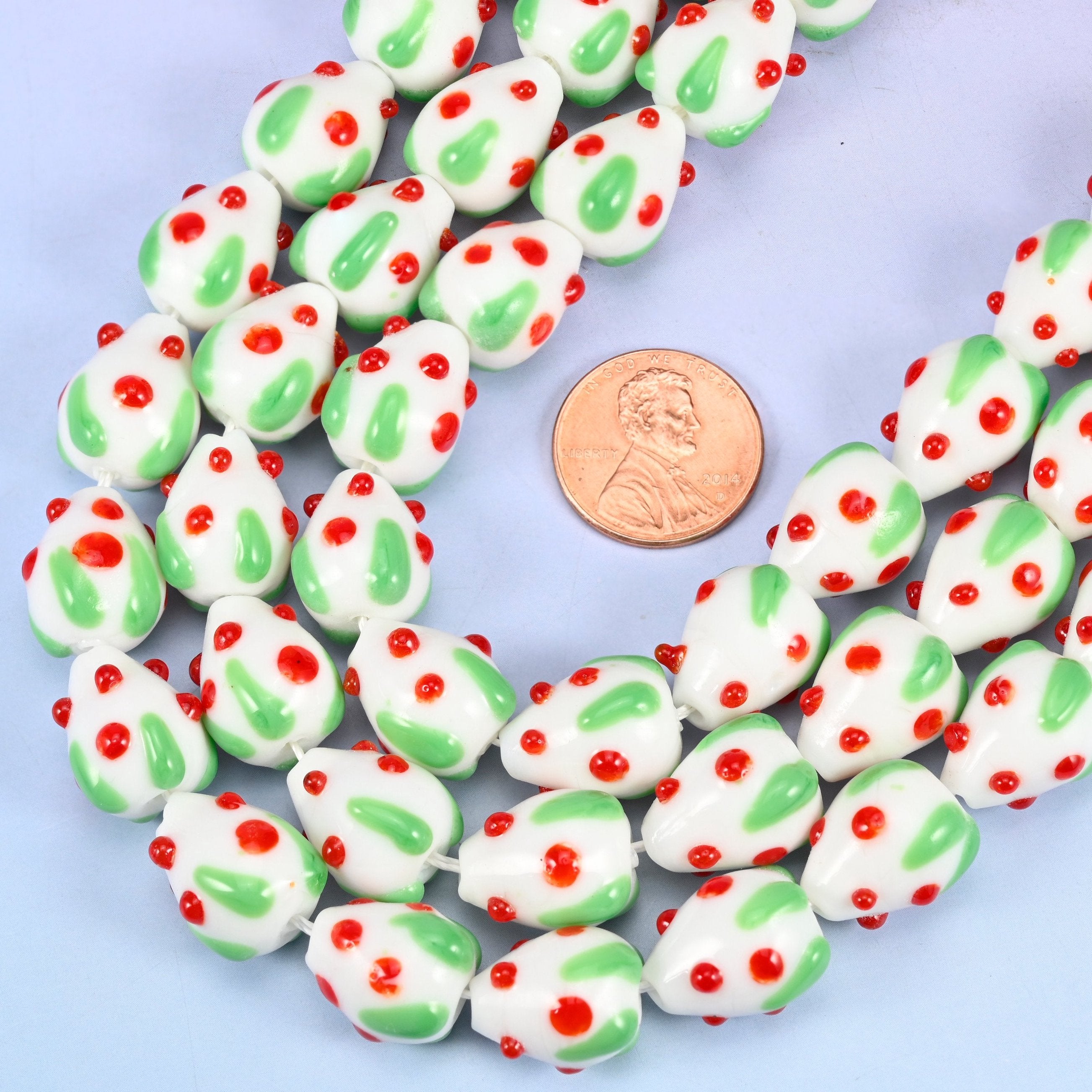 Strawberry shaped glass beads with painted red seed dots