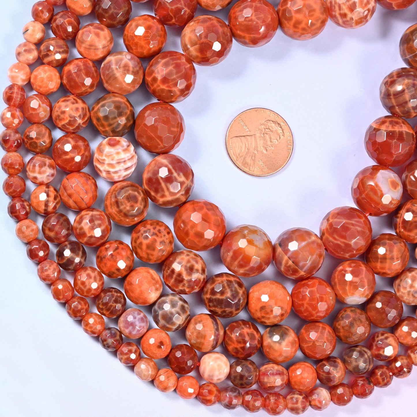 Fire Agate Faceted Round Beads, sold per 15 inch strand