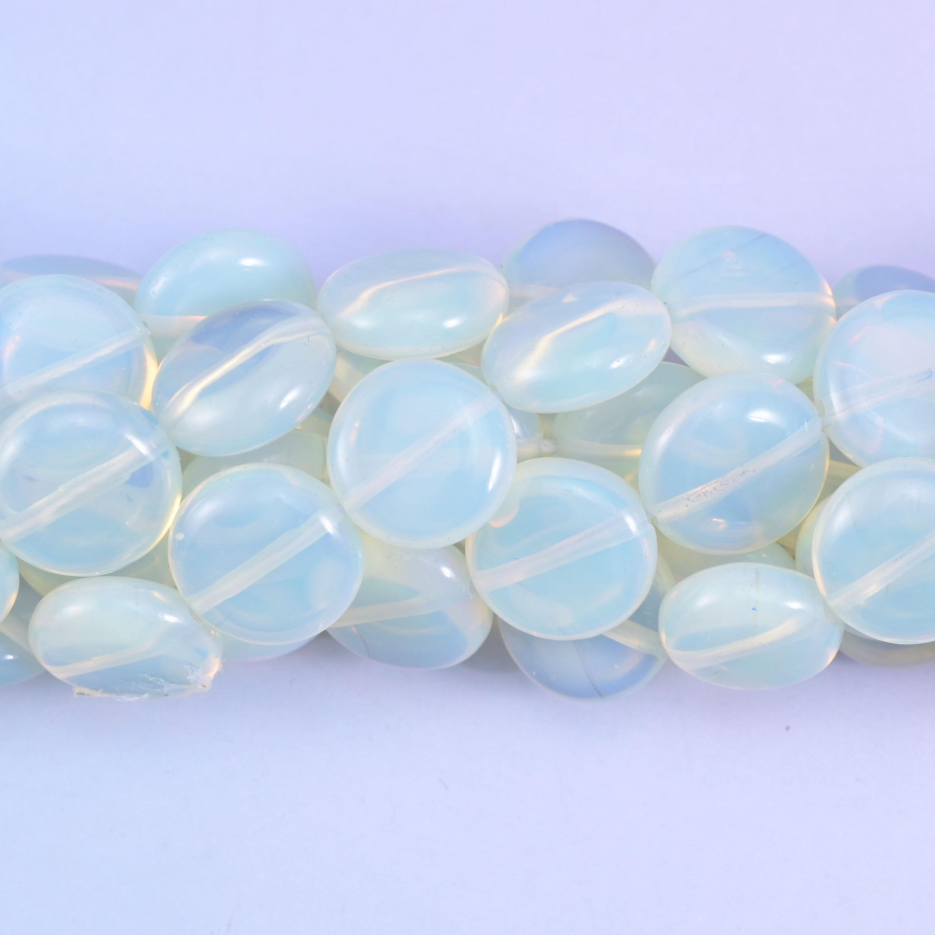 Coin cut Opalite glass beads with a high glassy polish