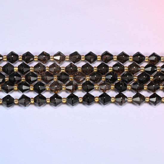 A single straight strand of 8mm Smoky Quartz faceted bicone beads laid flat, showing the full 15 inch length.