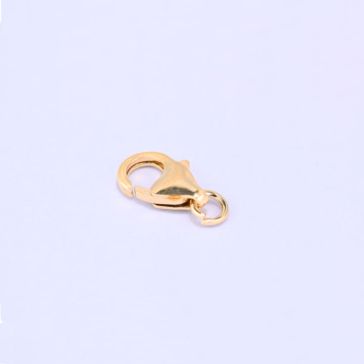 14K gold filled lobster clasp, 7x12mm, angled view with the jump ring at the lower right