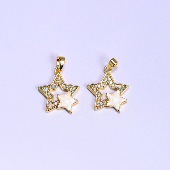 Double Stars Zirconia Charms in gold and white, two 18K gold plated pendants with clear zirconia pave outer stars and cream shell inner stars, shown side by side on a lilac background.