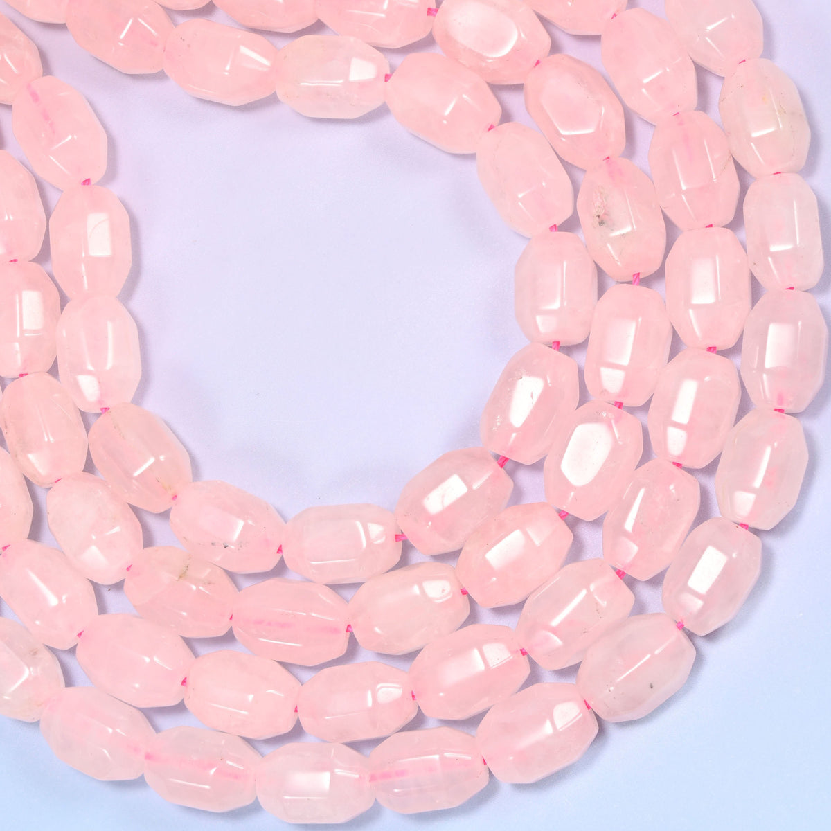 Natural Rose Quartz Faceted Barrel Beads with a 1.0mm centrally drilled hole.