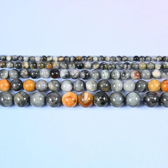 Eagle Eye Jasper Round Beads in silver-grey with black streaking and a cat's-eye sheen