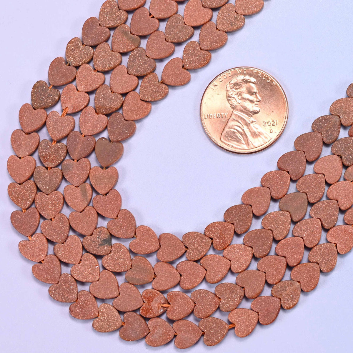 Flat heart cut gold sandstone beads