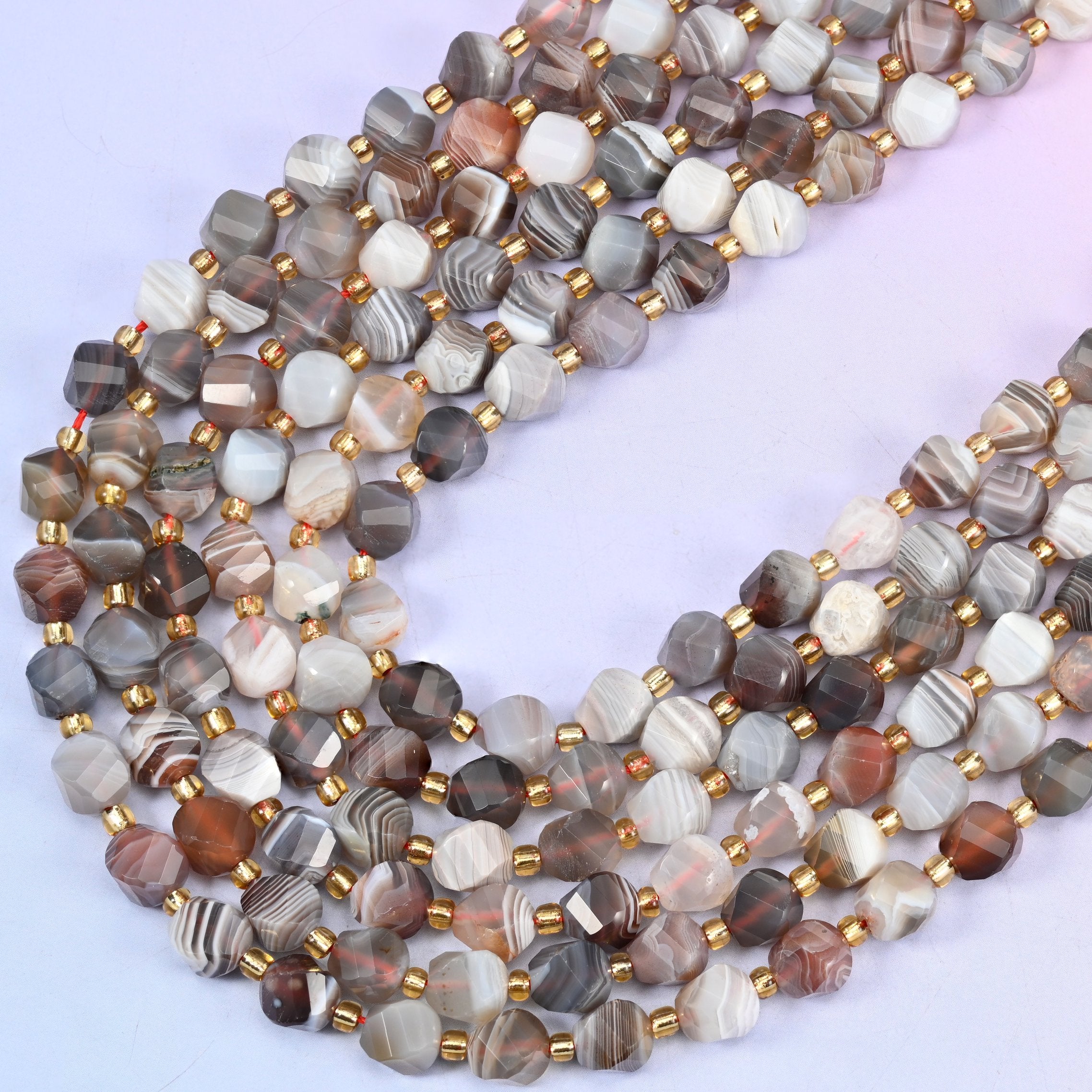 Botswana agate natural stone beads, eight-sided spiral twist cut catching light on every facet, 8mm