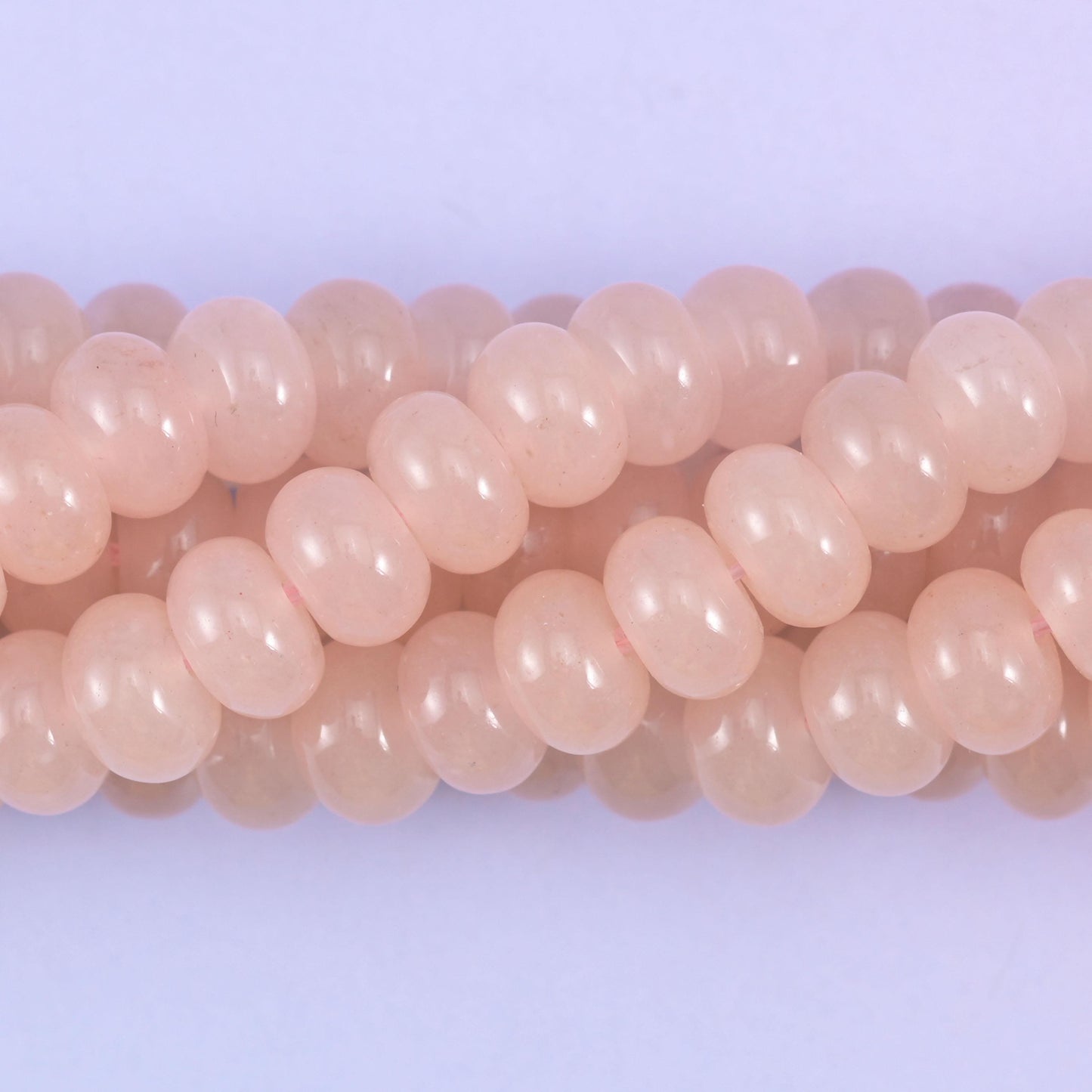 Smooth rondelle cut dyed jade beads, polished into tidy flattened shapes