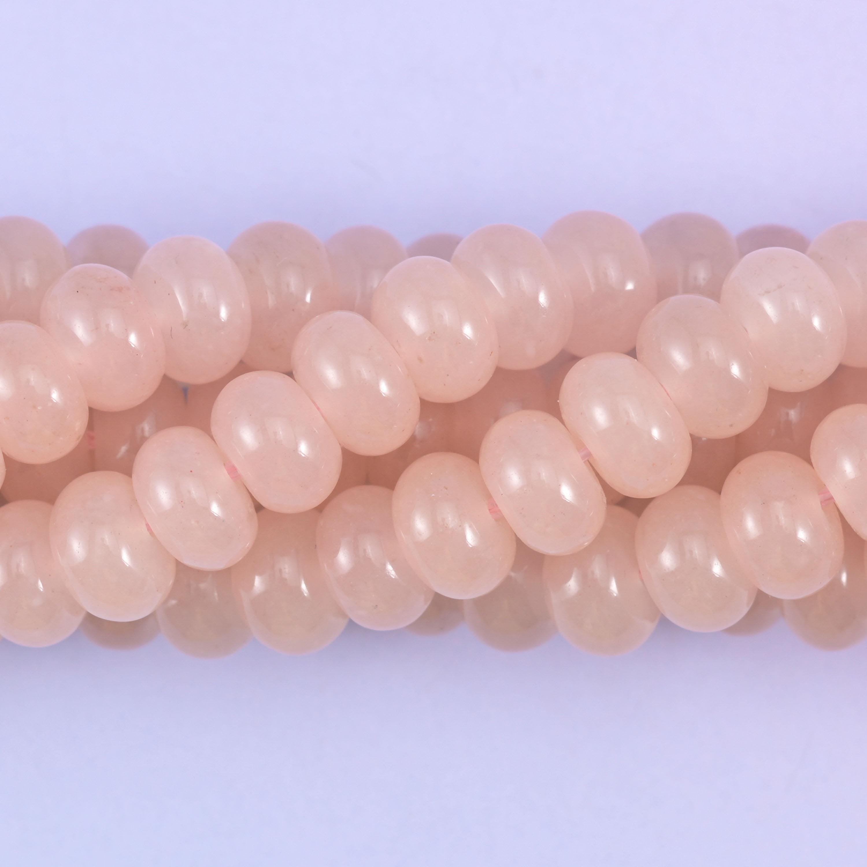 Smooth rondelle cut dyed jade beads, polished into tidy flattened shapes