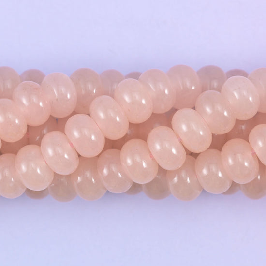 Smooth rondelle cut dyed jade beads, polished into tidy flattened shapes
