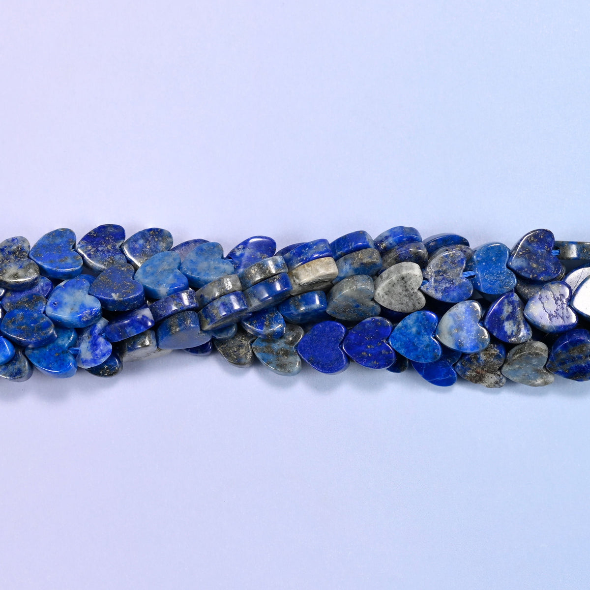 Lapis Lazuli Flat Heart Beads, deep royal blue marbled with grey-white calcite and a glint of pyrite