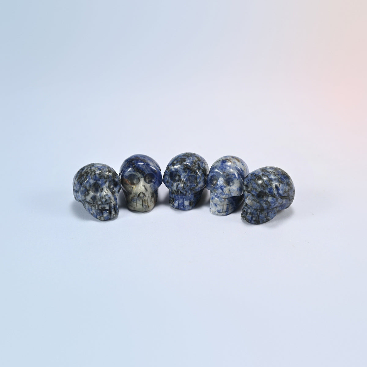 1 inch skull crystal carving in sodalite, deep blue natural stone with white veins