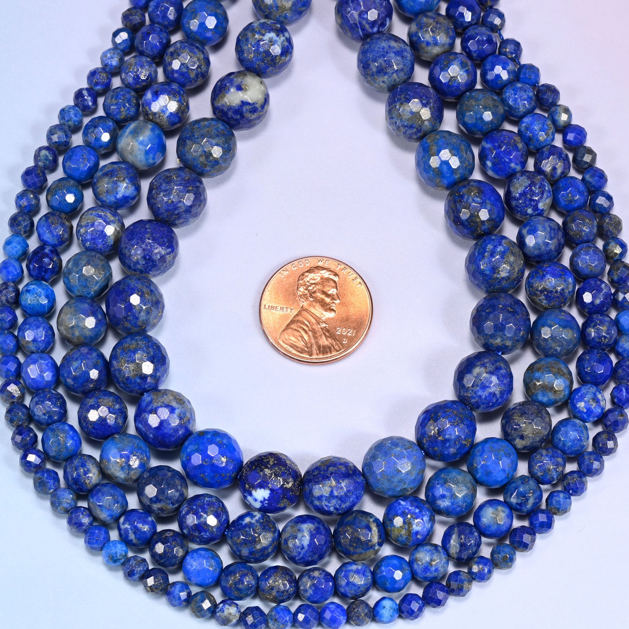 Lapis Lazuli Faceted Round Beads, approximately 86 beads at 4mm and 35 at 10mm per strand.