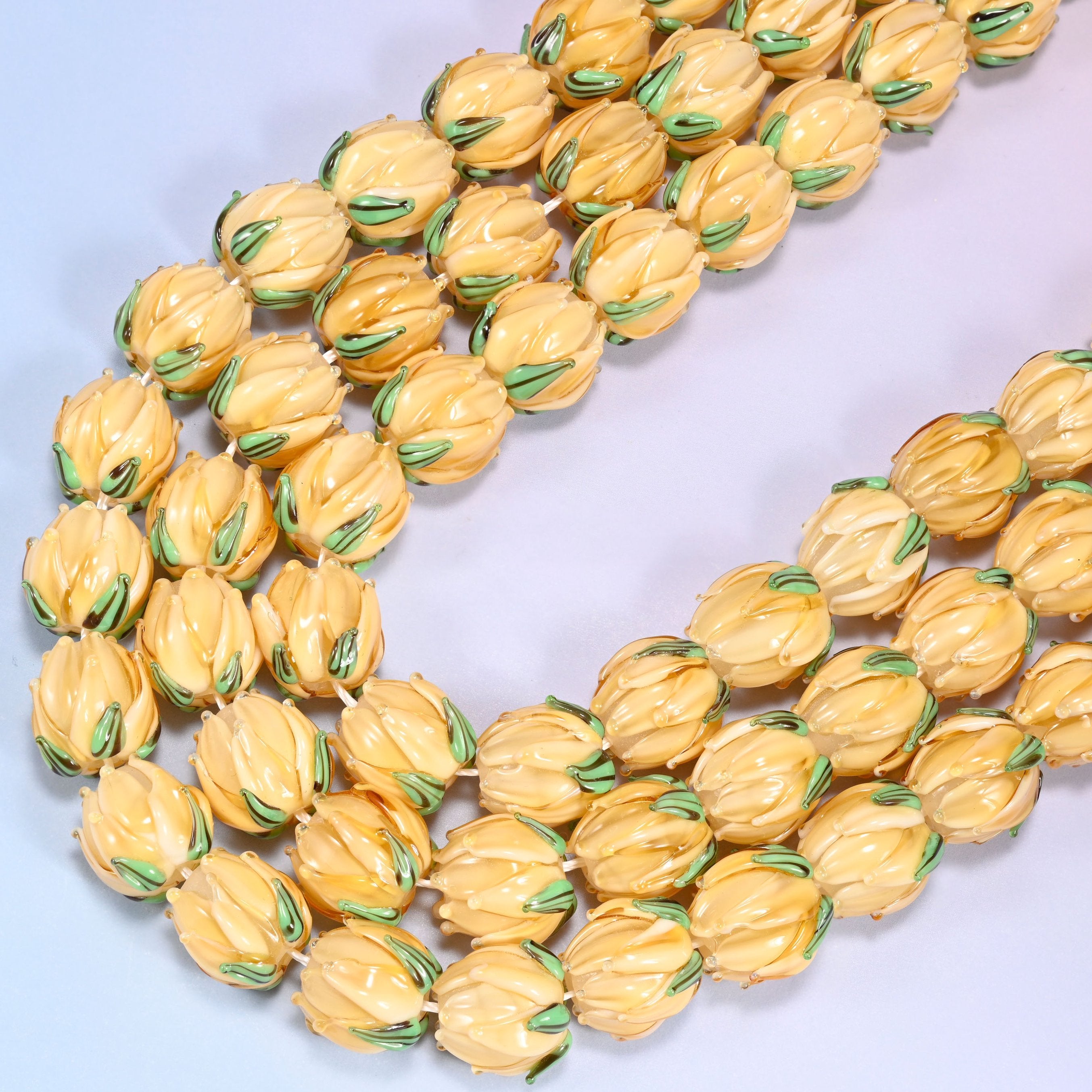 Creamy yellow tulip flower bud lampwork glass beads, 11 inch strand