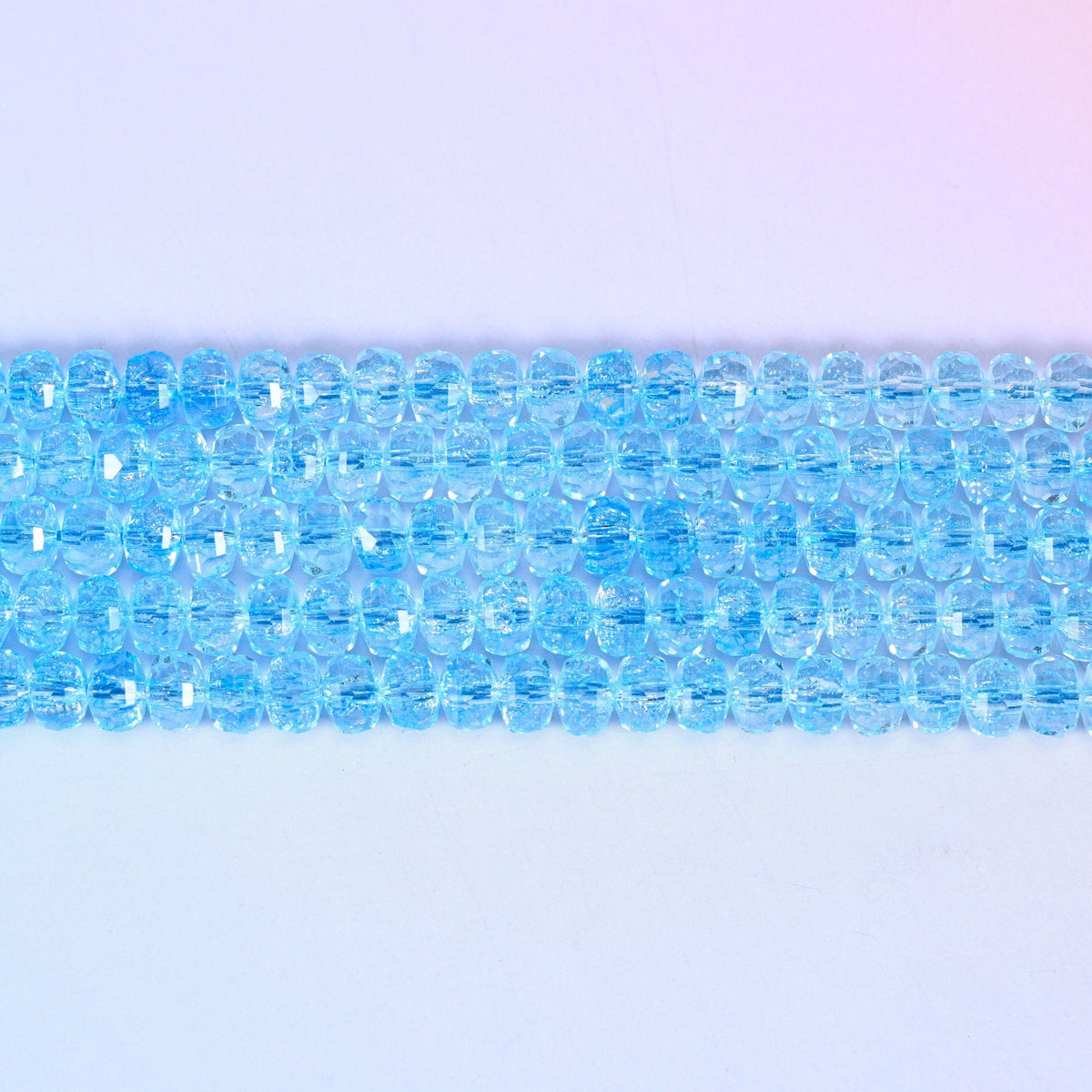 Transparent Blue Faceted Rondelle Glass Beads in a crisp aqua-blue tone