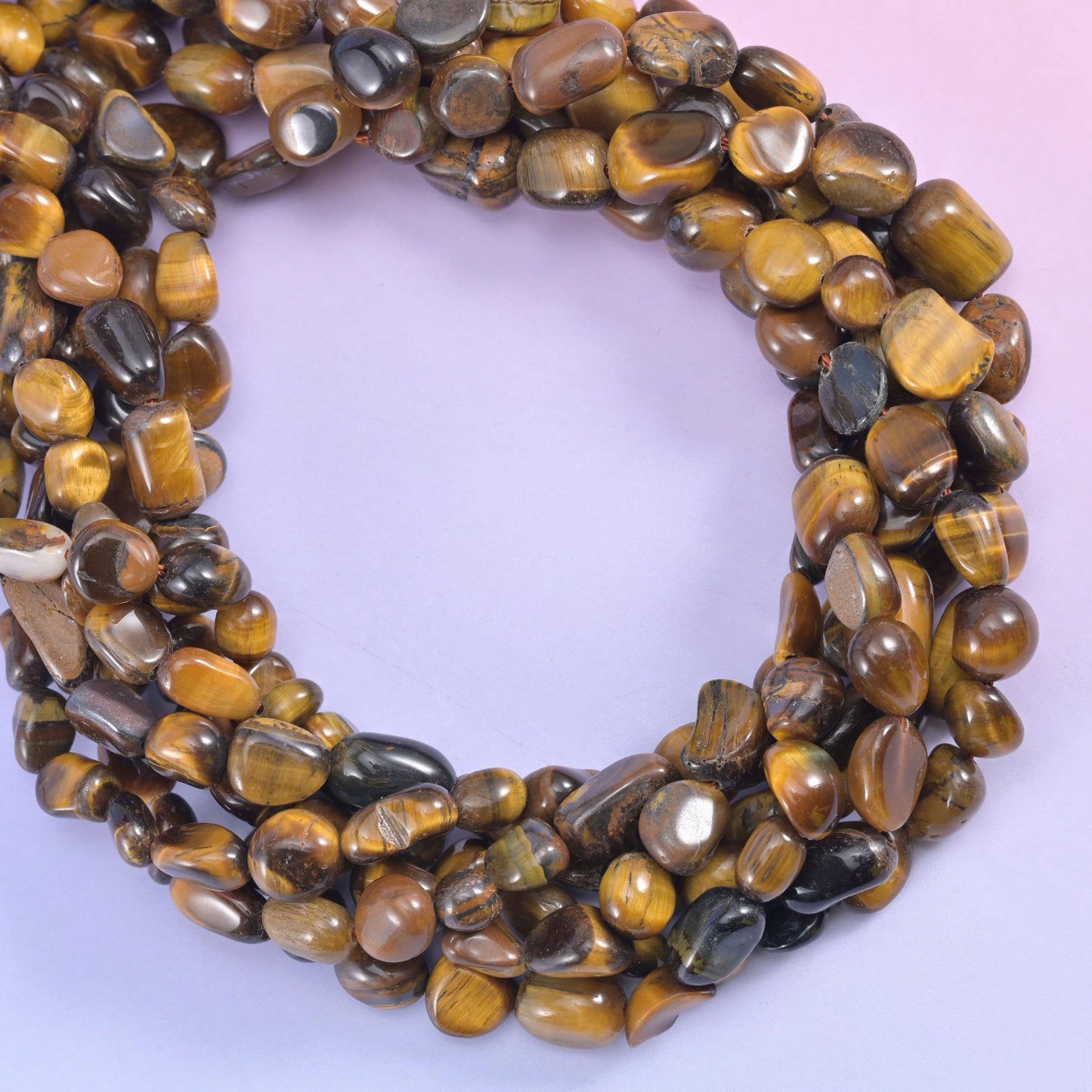 Tiger Eye Pebble Nugget Beads, silky chatoyant shimmer sliding across the surface as the strand turns