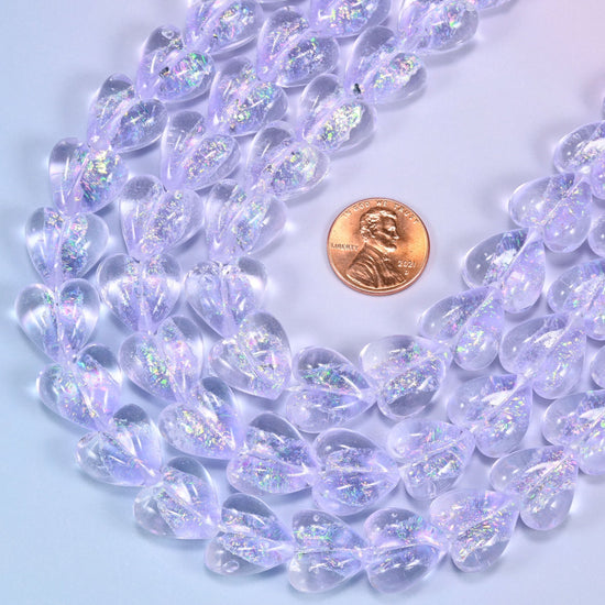 Transparent pale lilac glass heart beads with glittering iridescent shimmer