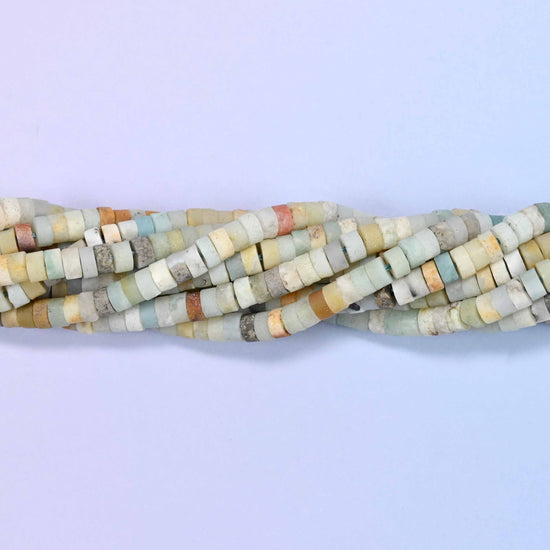 Natural multicolor amazonite matte heishi disc beads in a mix of soft cream, tan, gray and blue-green tones.