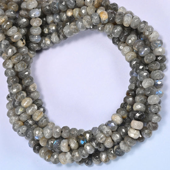 Gray Labradorite faceted rondelle beads coiled tight, light and dark discs alternating along the same strand