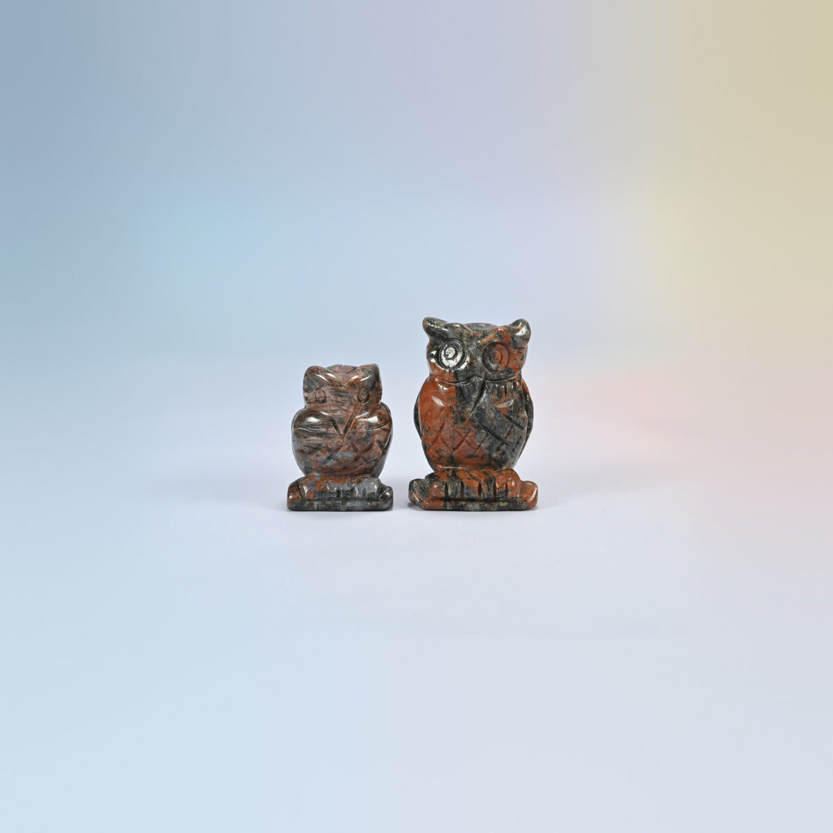 Owl crystal carving in mahogany obsidian, red-brown and black natural stone