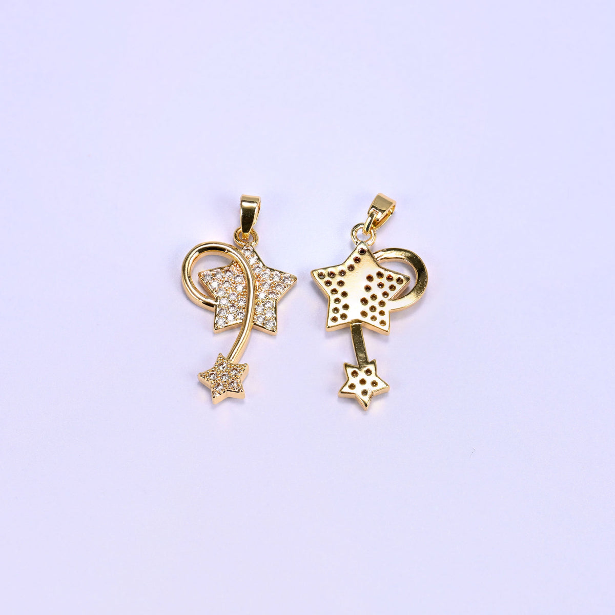 Gold wishing star zirconia charms shown from both sides, one pendant face up and one reversed to reveal the smooth back.