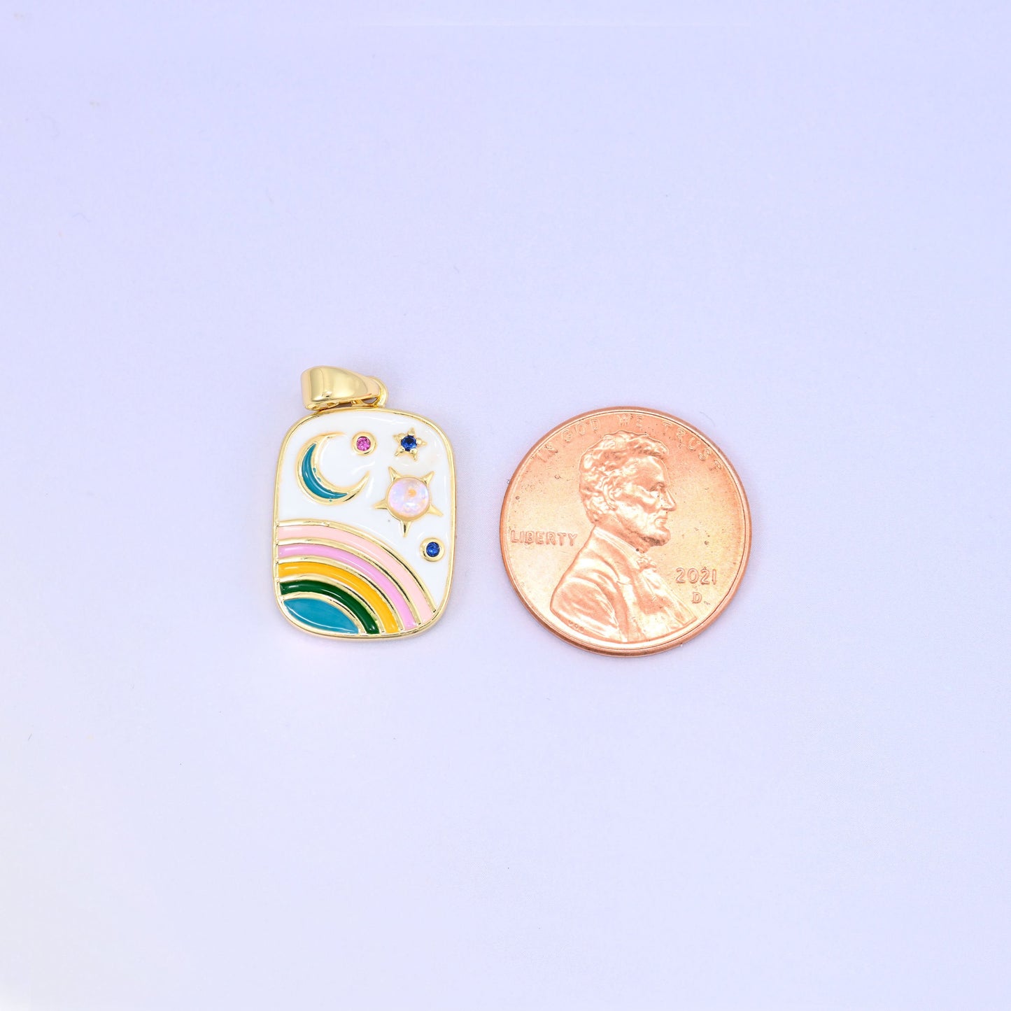 Enamel rainbow rectangle pendant with opal-toned sun and zircon stars