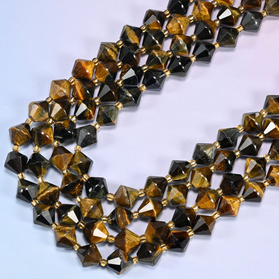 10mm Iron Tiger Eye faceted bicone beads arranged in a loose curved strand on a light lavender background.