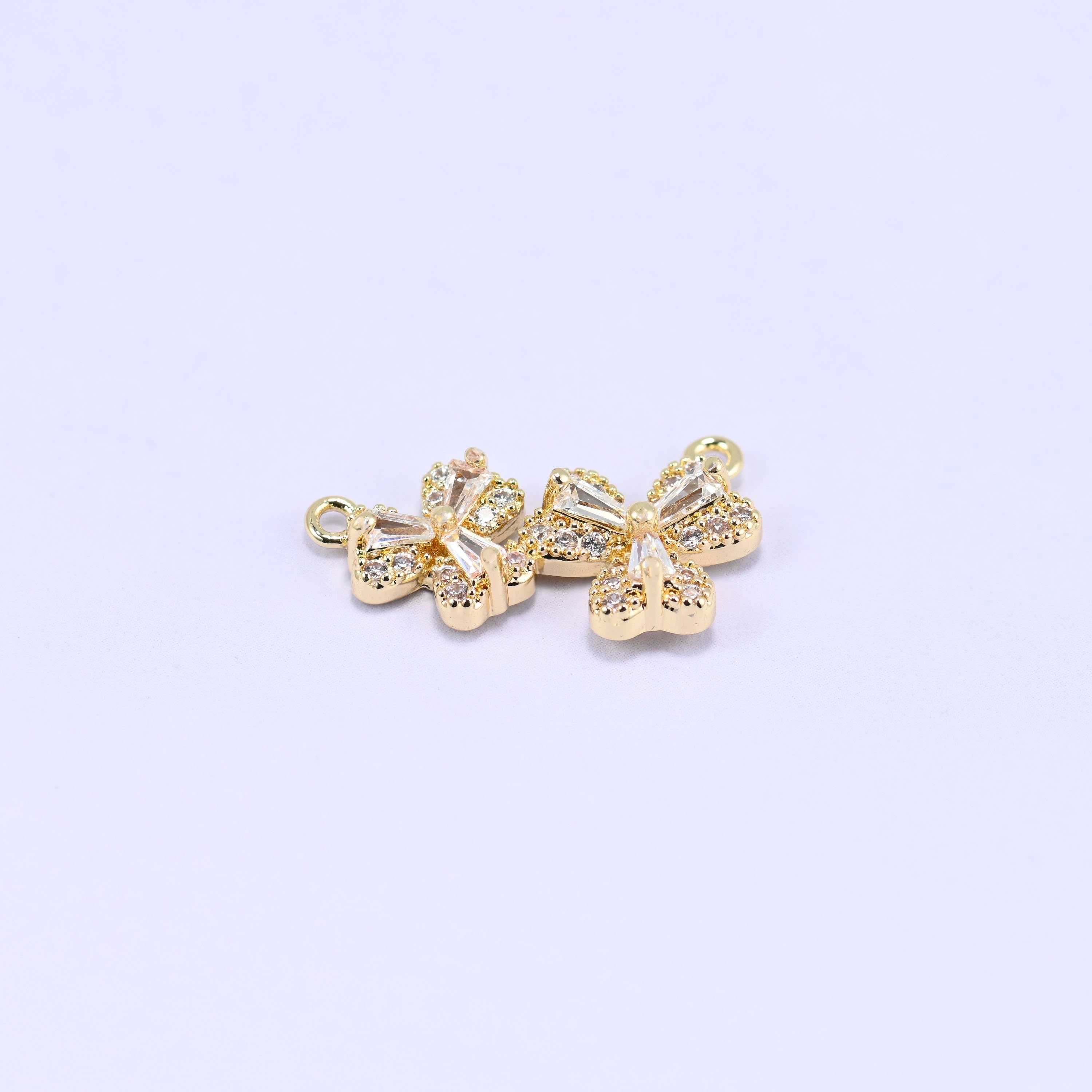 Three small blossoms pave set with clear zircon in a gently curved row
