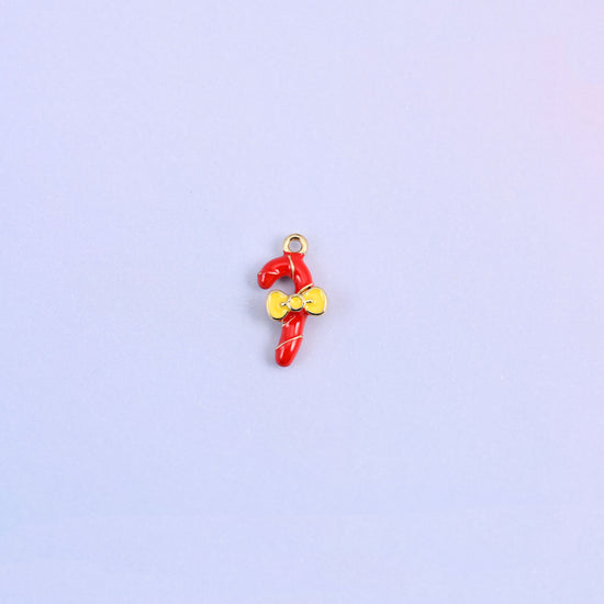 Single red candy cane charm with a gold spiral stripe and a yellow enamel bow at the crook.