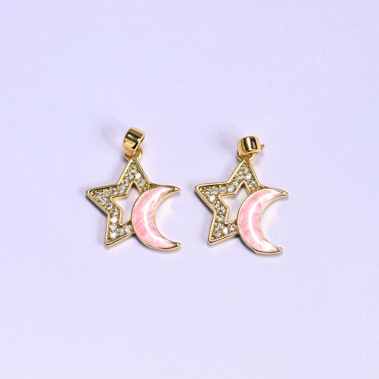 Two pink Star Shell Moon Zirconia Charms side by side, each with a pink shell crescent moon nested inside a zirconia pave star outline.