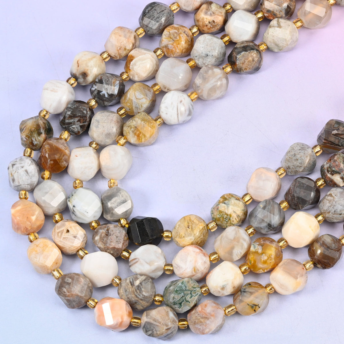 Bamboo Agate natural stone beads, many-sided spiral twist cut catching light on every facet, 10mm