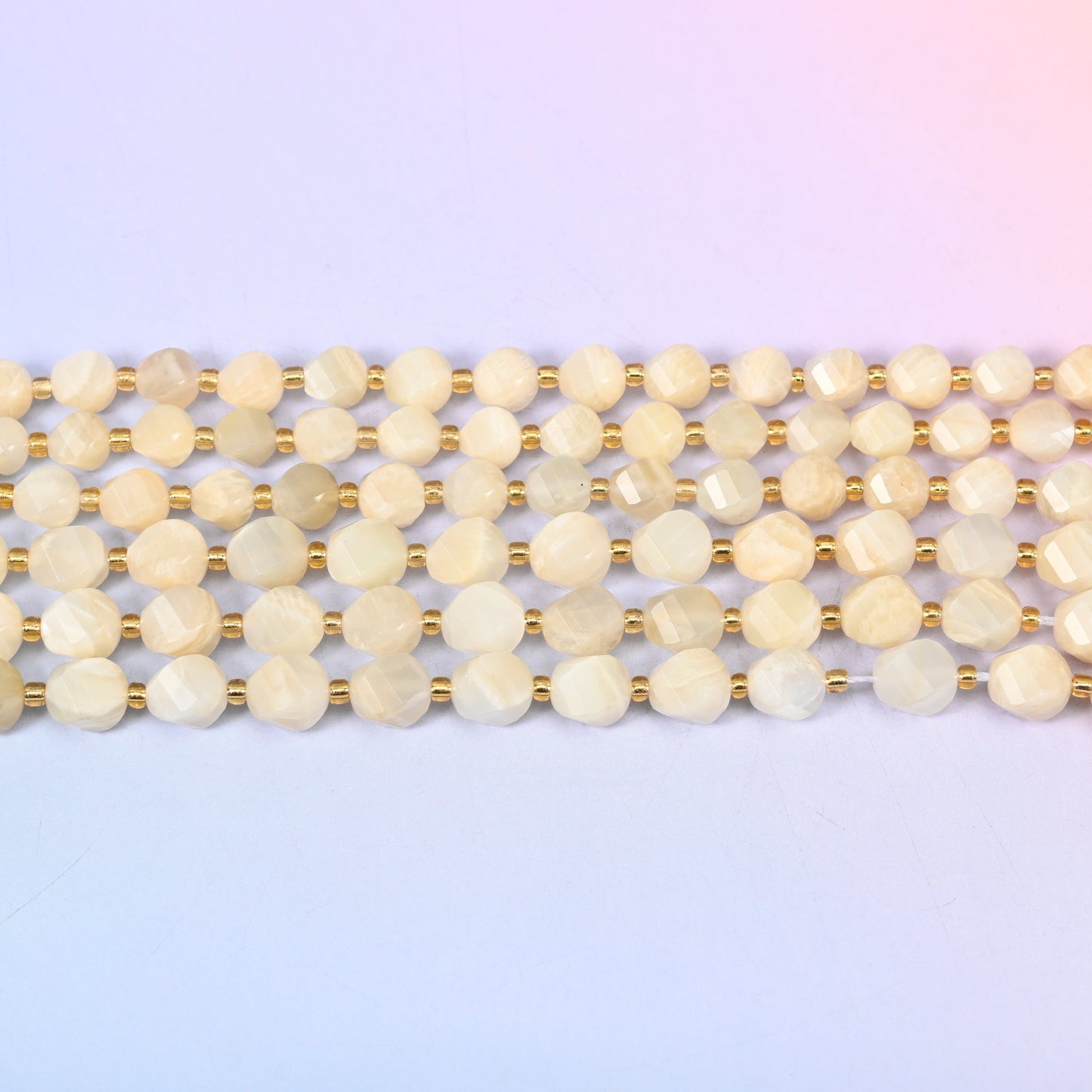 White Moonstone beads in creamy ivory and pale champagne with a soft inner glow