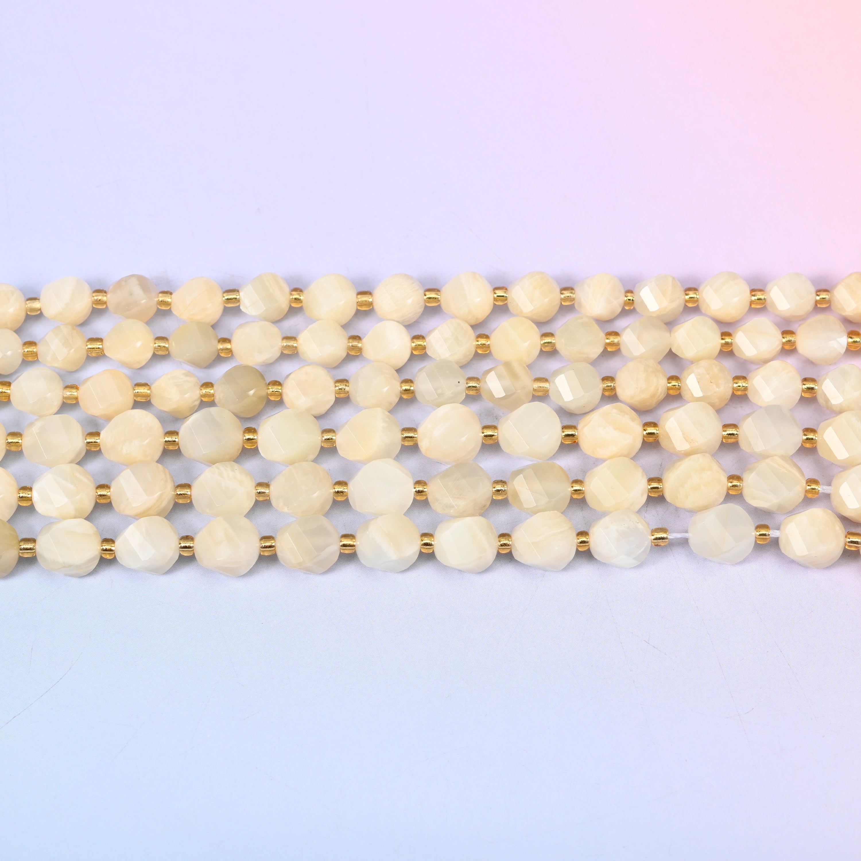 White Moonstone beads in creamy ivory and pale champagne with a soft inner glow