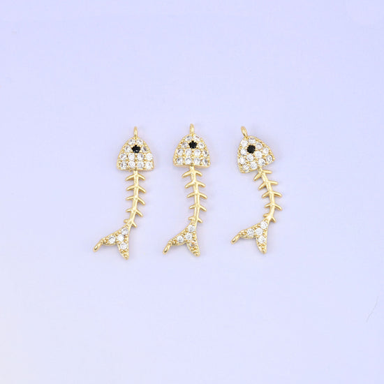 Brass fishbone charm with sleek zirconia accent