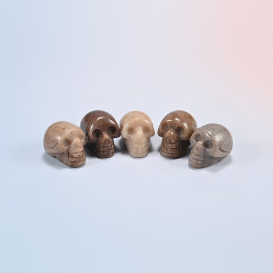 1 inch skull crystal carving in purple aventurine, brown-purple natural stone with sparkle